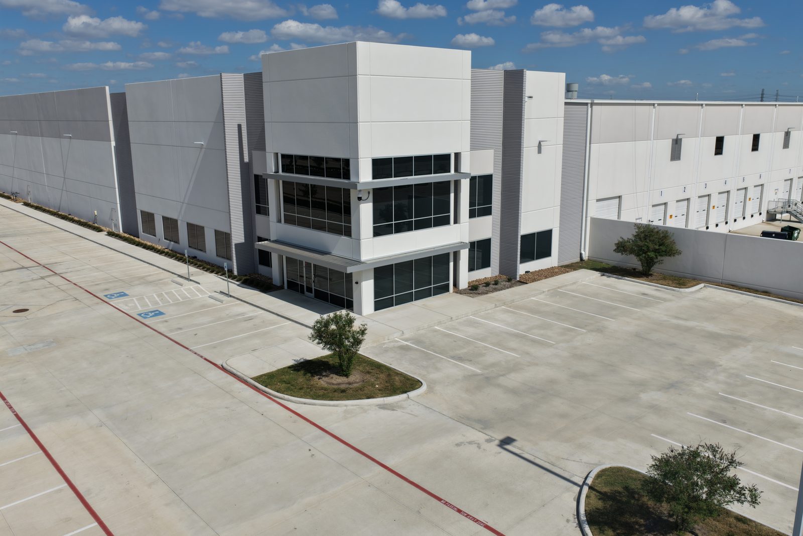 Elevated view of a facility entrance and parking, Houston